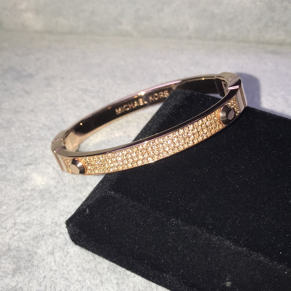 Michael Kors hinge bracelet. Gold color with rhinestone crystals. Pre-owned.
